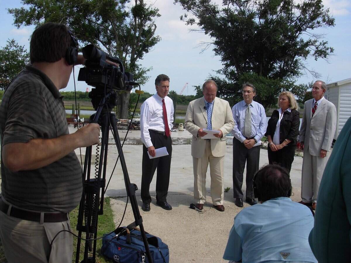 In 2007, attorneys with the Scruggs Katrina Group, including former state Attorney General Mike Moore, left, and Richard “Dickie” Scruggs, far right, announce a lawsuit filed against State Farm Insurance companies while standing on the slab where policyholder Glenda Shows of Pascagoula’s house stood. The men are pictured with Shows, one of hundreds of policyholders who sued their insurers after their wind damage claims were denied.
