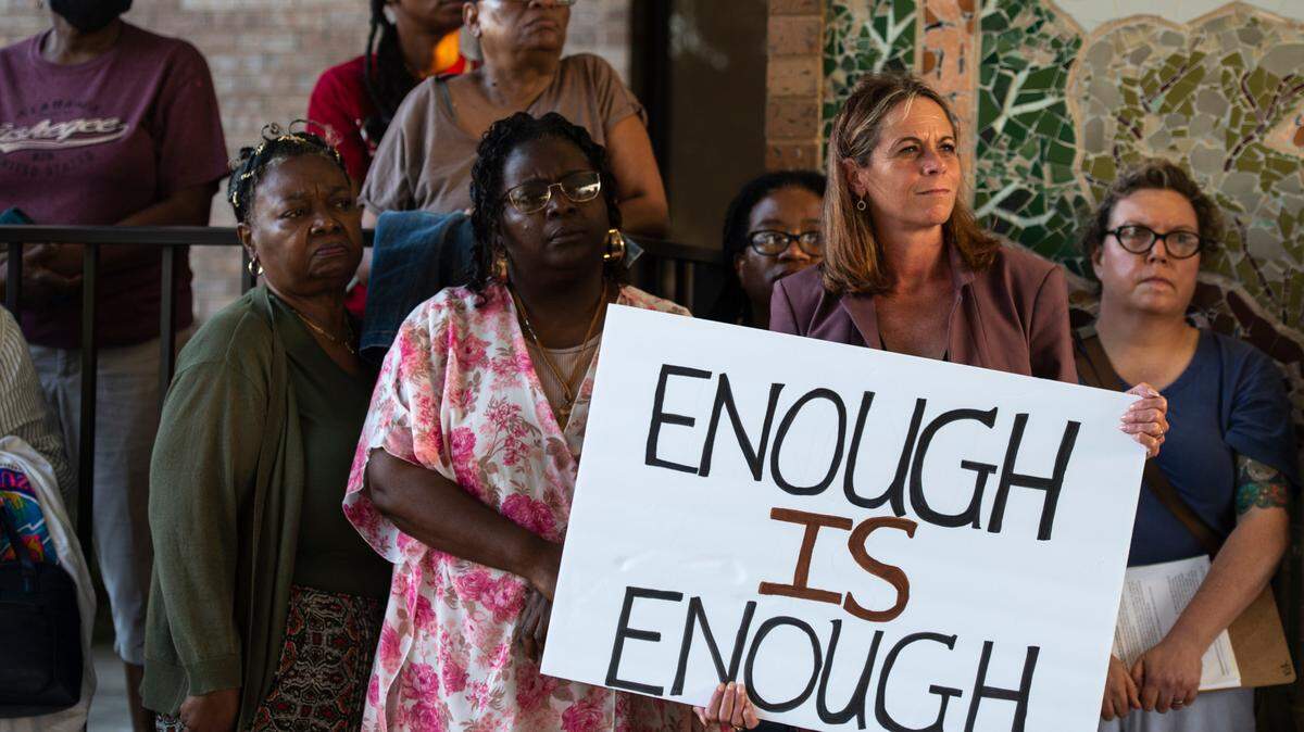 Members of We Shall Not Be Moved, a group protesting a proposed urban renewal plan for the city of Ocean Springs, stand outside the city Civic Center on Wednesday, Sept. 20, 2023.