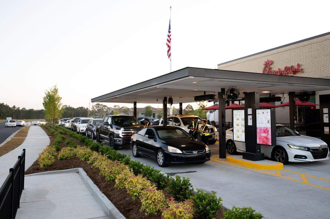 Lines of cars spill onto Center Drive during the opening of the new Chick-fil-A in Ocean Springs on Thursday morning.