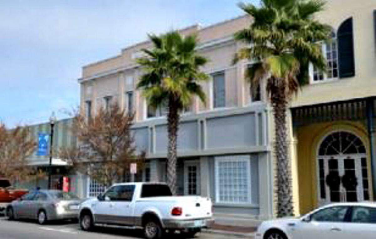 The Anderson Theater building in downtown Gulfport is pictured before a $2.4 million restoration project combined it with the original Balch & Bingham law office to the right.