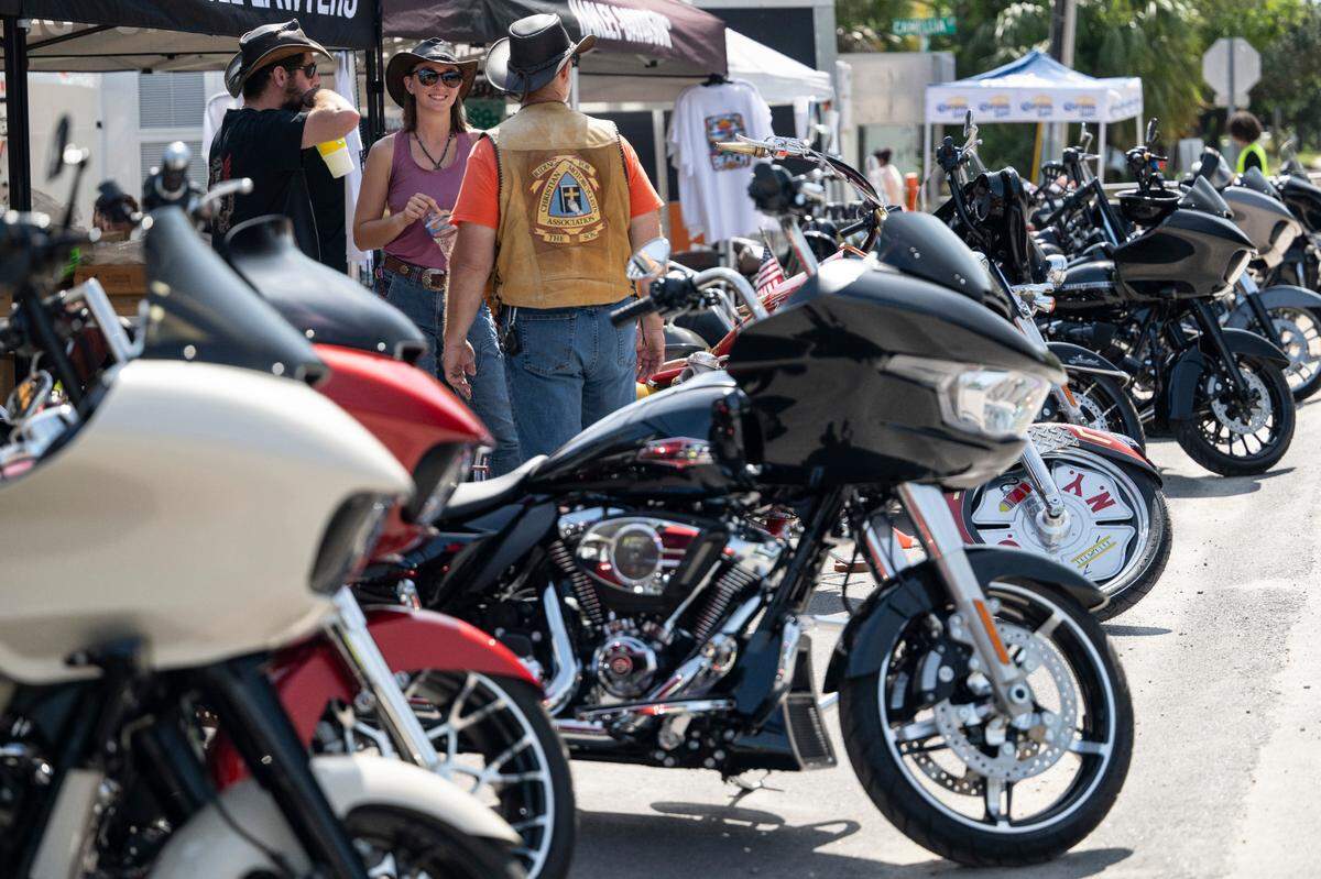 Motorcycle lovers walk among motorcycles and vendors at Bikin’ The Beach in Biloxi on Friday, June 6, 2025.