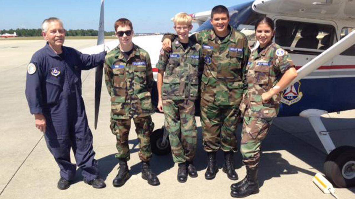 COURTESY BILL HENRYLt. Col. Danny Watson visits with cadets Noah Bend, Connor McClellan, Percy Barberena, and Haley Holtorf during the Civil Air Patrol cadet program Sept. 20.