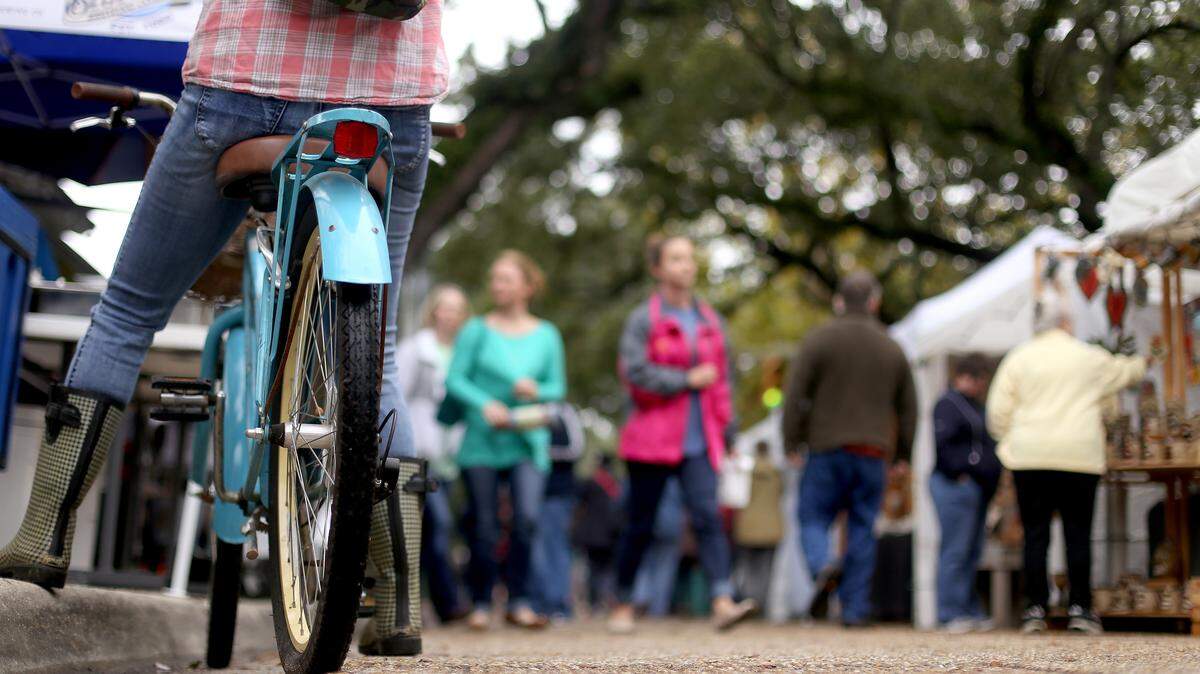 AMANDA McCOY/SUN HERALD 
 Rain doesn't keep the crowds from the last day of the 37th annual Peter Anderson Arts and Crafts Festival on Sunday, November 8, 2015.