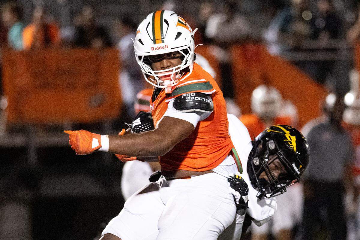 West Harrison running back Sean Fairley (3) attempts to spin out of a tackle against D’Iberville earlier this season. Fairley was the Week 7 winner of the Athlete of the Week poll.