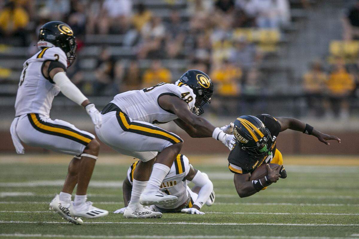 Southern Miss’s Darius Maberry is tackled after running the ball during the Southern Miss versus Grambling State game on Saturday, Sept. 11, 2021.