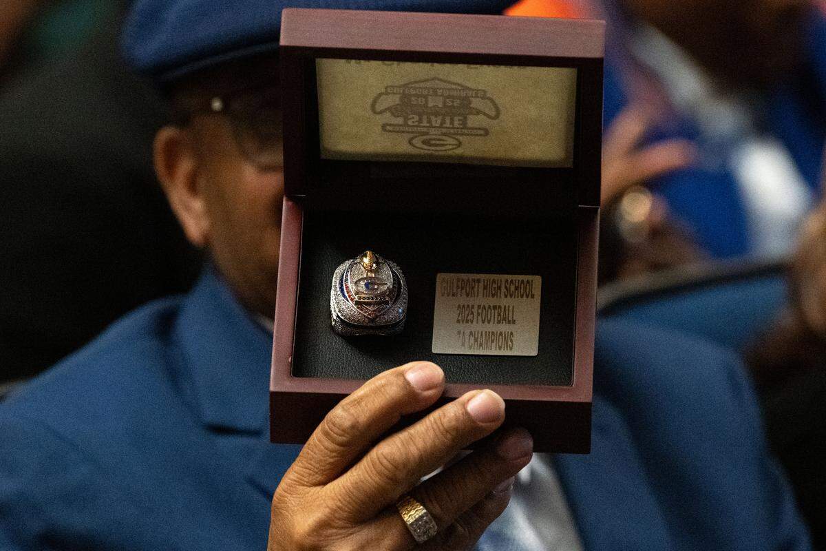 Charles Evans shows off his championship ring.