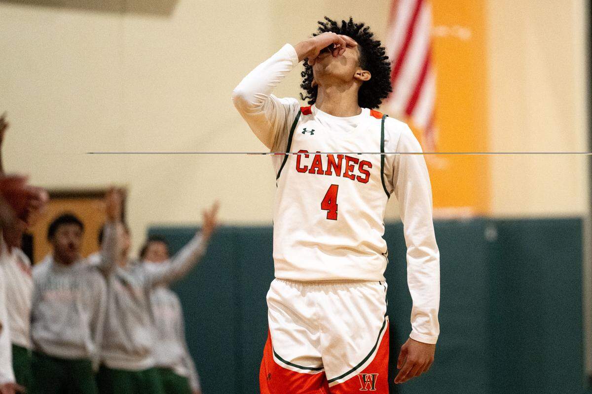 West Harrison's Logan Robinson (4) celebrates a three-point shot during a basketball game at West Harrison High School on Tuesday, Jan. 13, 2026.