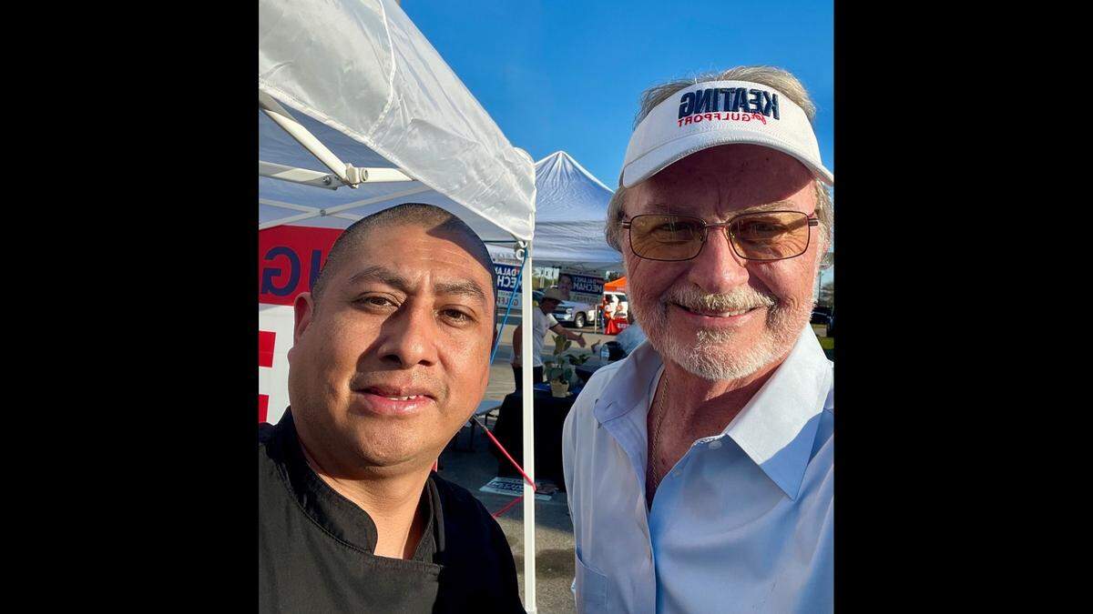 Hugh Keating, right, the Republican candidate for Gulfport mayor, is pictured in March at a Main Street meet-and-greet with supporter Joaquin Morales. Keating said he had no control over comments that fellow Republican Joel Carter, a state senator, made about Democratic mayoral candidate Sonya Williams Barnes.