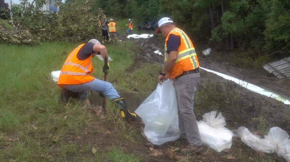 A crew works to remove fuel from the soil after an 18-wheeler wrecked near Delisle on I-10 in the early morning hours of July 9, 2021. The spill threatened the Wolf River and its tributaries.