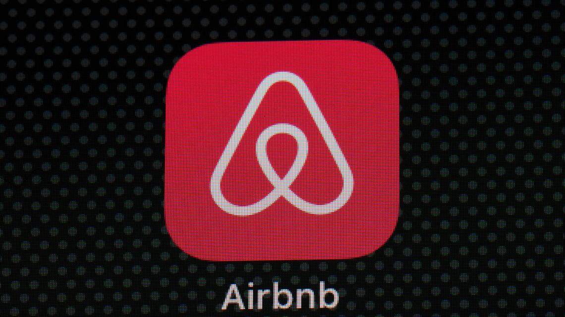 FILE - The Airbnb app icon is displayed on an iPad screen in Washington, D.C., on May 8, 2021. A man accused of armed robbery booked a room at a home in Buford, Georgia, on the site then tied up the homeowner and robbed him at gunpoint. (AP Photo/Patrick Semansky, File)