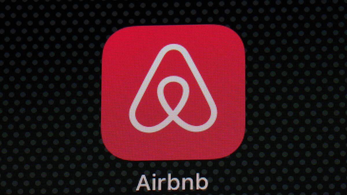 FILE - The Airbnb app icon is displayed on an iPad screen in Washington, D.C., on May 8, 2021. A man accused of armed robbery booked a room at a home in Buford, Georgia, on the site then tied up the homeowner and robbed him at gunpoint. (AP Photo/Patrick Semansky, File)