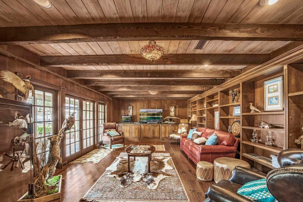 The Lodge at Running Creek features a spacious great room with stone fireplace, nine bedrooms, eight baths and suites. It is one of numerous buildings on the property.