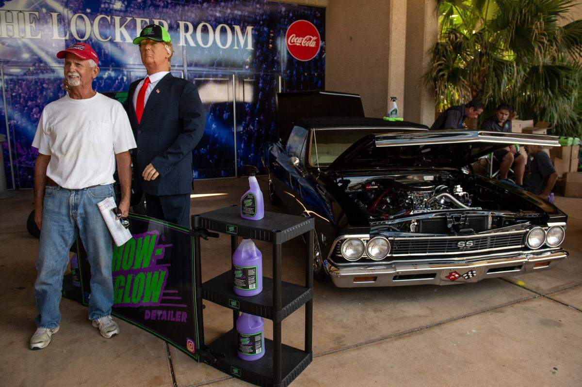 A life-size wax figurine of Donald Trump advertises for a car detailer during the Cruisin’ The Coast swap meet at the Mississippi Coast Coliseum and Convention Center on Thursday, Oct. 7, 2021.