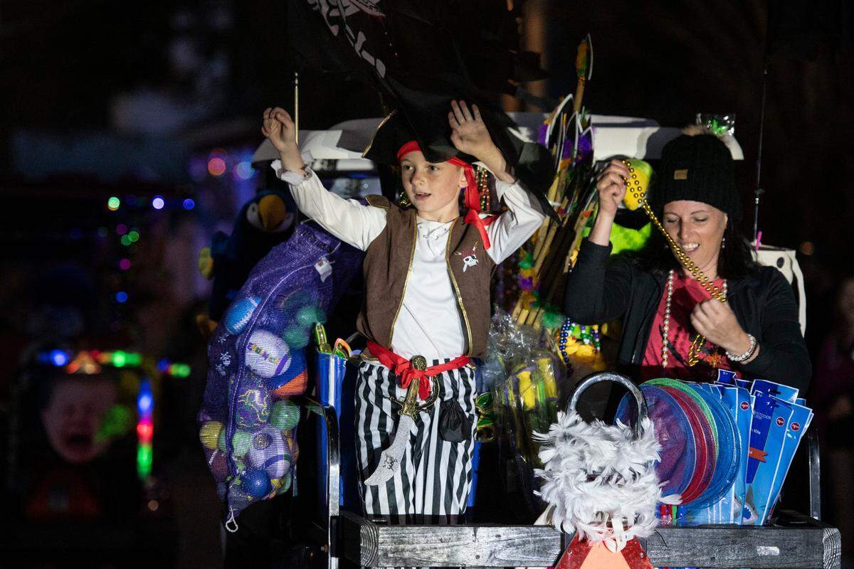 A float rider waves to the crowd during Mystic Krewe of the Seahorse’s Lundi Gras parade in Bay St. Louis on Monday, March 3, 2025.