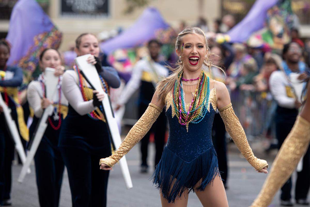 The Mississippi Gulf Coast Community College Band of Gold marches during the Gulf Coast Carnival Association Mardi Gras parade in Biloxi on Tuesday, March 4, 2025.