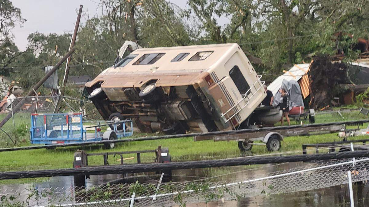 A mobile home is turned on its side off Main Street in Moss Point after a tornado struck the town Monday.