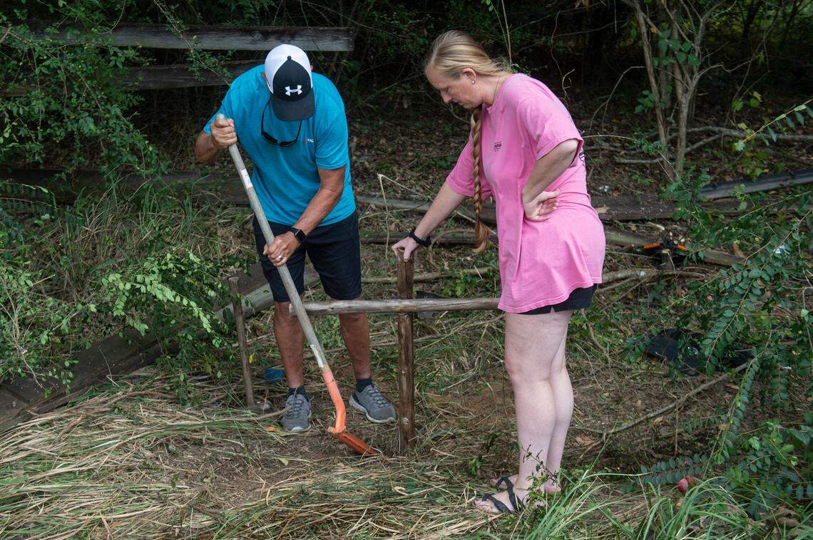 The family members of Baleigh Bowlin and Chloe Taylor set up a cross memorial for the girls at the site of a fatal car accident that claimed the lives of both girls off of Highway 613 in Hurley on Monday, Oct. 17, 2022.