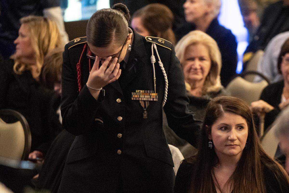 Lily Estorffe reacts during the visitation for her brother Branden Estorffe during the funeral of Bay St. Louis police officers Sgt. Steven Robin and Branden Estorffe at the Bay St. Louis Community Center in Bay St. Louis on Wednesday, Dec. 21, 2022. Robin and Estorffe were killed responding to a call at a Motel 6 on Dec. 14.