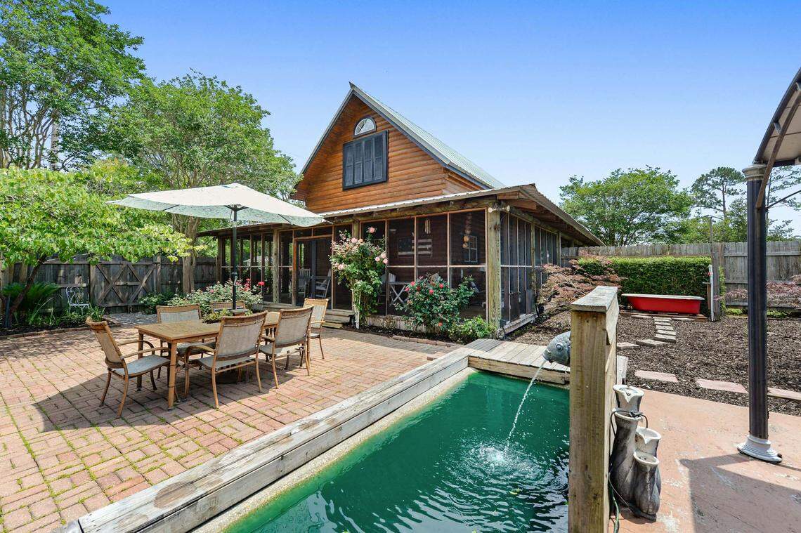 The view of the Breezy Porches house in Waveland from a courtyard that sits between the house and a building that includes two apartments.