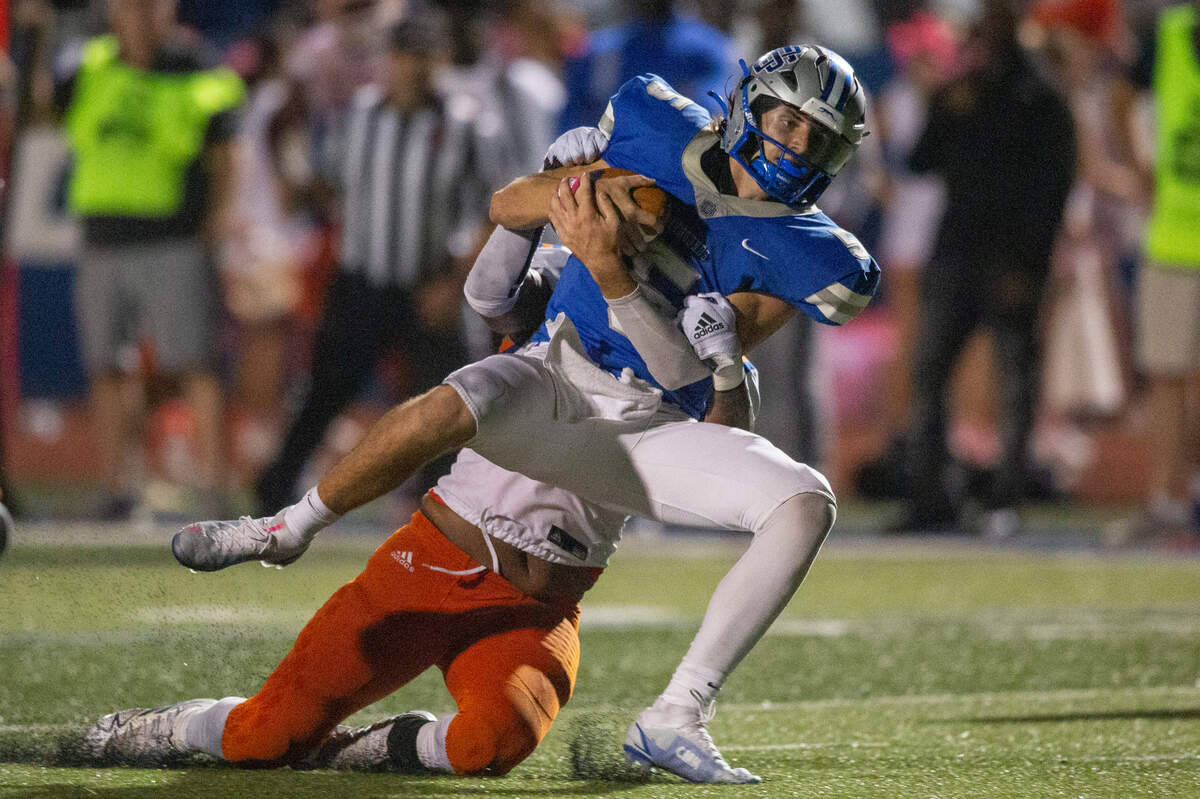 Ocean Springs’ quarterback Bray Hubbard gets tackled during a game at Greyhound Stadium in Ocean Springs on Friday, Oct. 28, 2022.