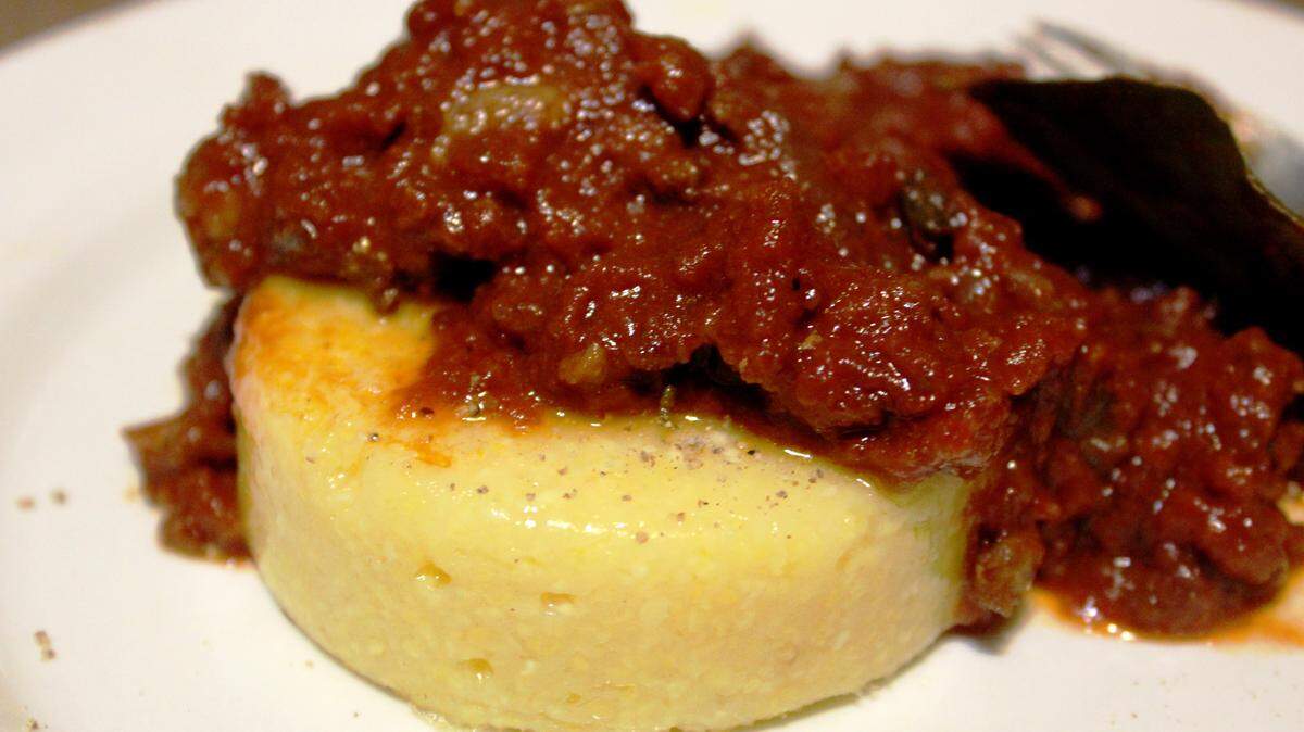 JULIAN BRUNT/SPECIAL TO THE SUN HERALDGrits or polenta with a red sauce is a classic Italian idea.