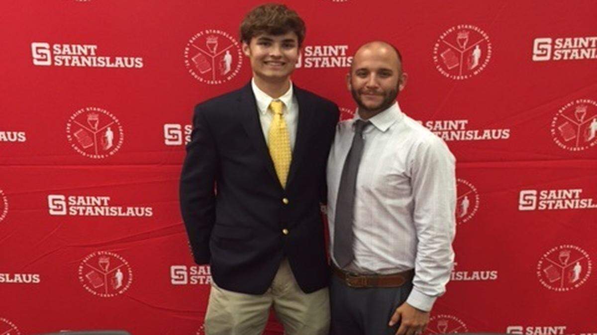 PHOTO COURTESY JIM ESTRADA 
 St. Stanislaus senior James Estra and tennis coach Ryan Joiner pose for a photo after Estrada signed a tennis scholarship with Mississippi Gulf Coast CC.