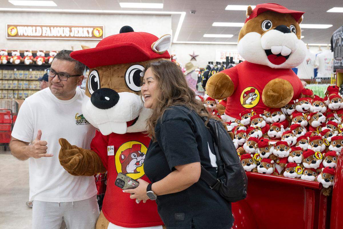 Customers pose with Buc-ee as the popular travel stop opened its first Mississippi location in Harrison County on Monday, June 9, 2025.