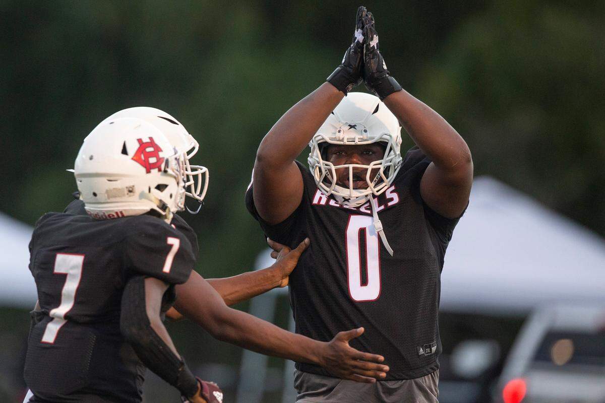 Harrison Central kicker and defensive lineman Amarion Ware scores a safety during a game against Oak Grove at Milner Stadium in Gulfport on Friday, Aug. 26, 2022.