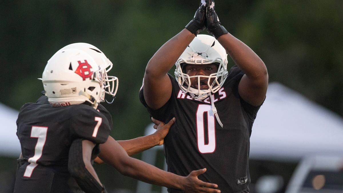 Harrison Central kicker and defensive lineman Amarion Ware scores a safety during a game against Oak Grove at Milner Stadium in Gulfport on Friday, Aug. 26, 2022.