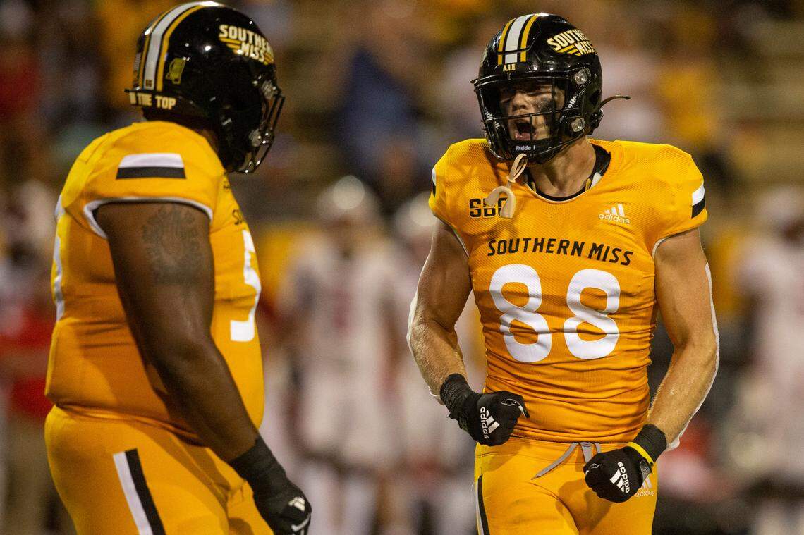 Southern Mississippi tight end Luke Baker (88) cheers with his teammate after a play against Liberty during a NCAA college football game in Hattiesburg, Miss., Saturday, Sept. 3, 2022. Southern Mississippi lost 29-27