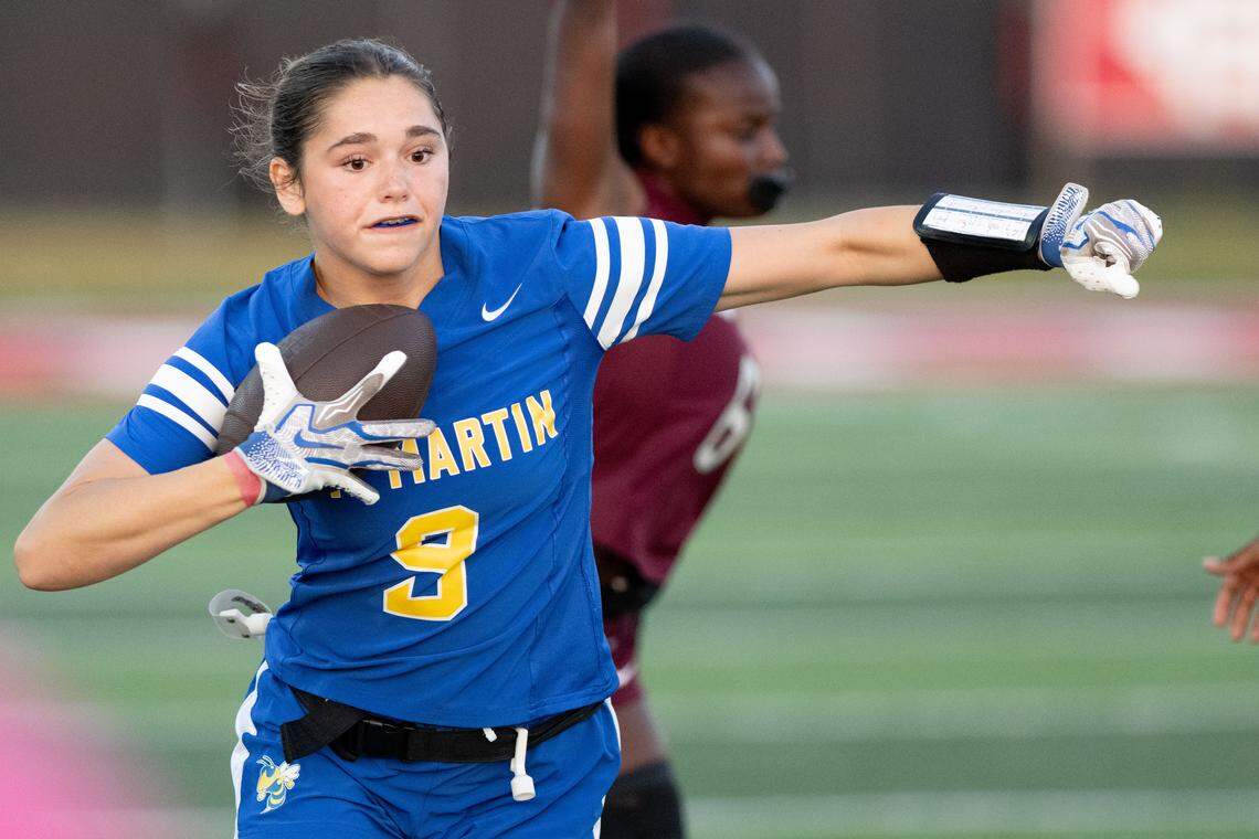 St. Martin’s Khloe Letort (9) runs with the ball during a flag football game at Harrison Central High School on Thursday, April 23, 2026.