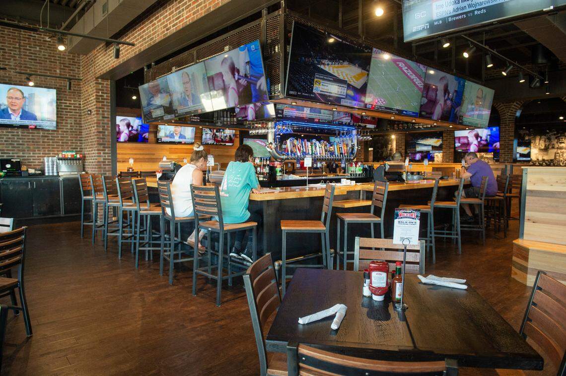 The bar at the new Walk-On’s Sports Bistreaux in D’Iberville on Thursday, Sept. 22, 2022. The restaurant features 57 televisions broadcasting sporting events.