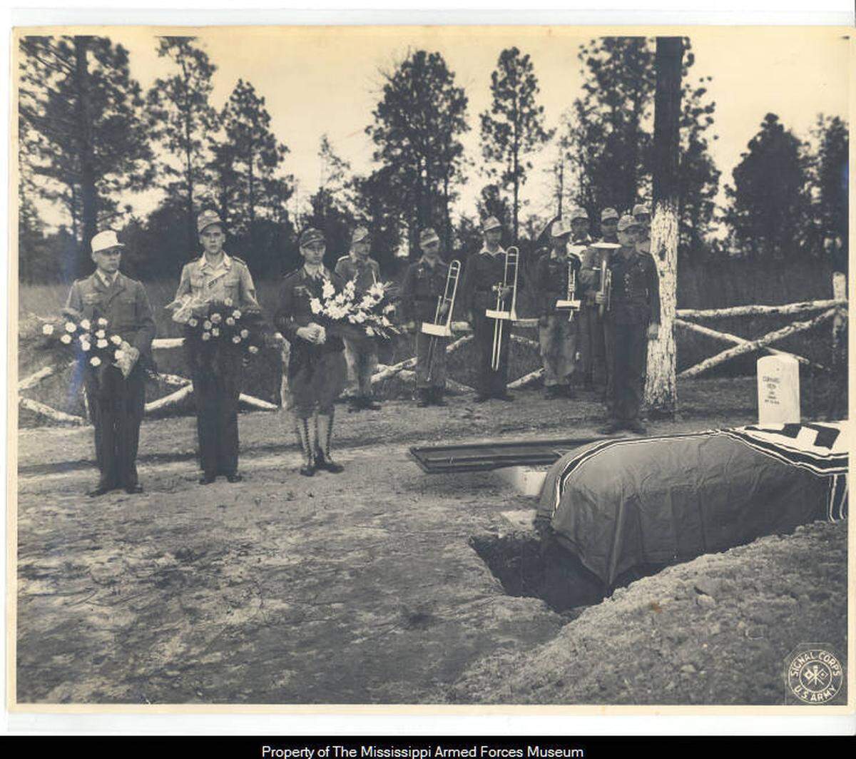 German prisoners of war attending the funeral procession for one of their comrades who died during his captivity in Mississippi.