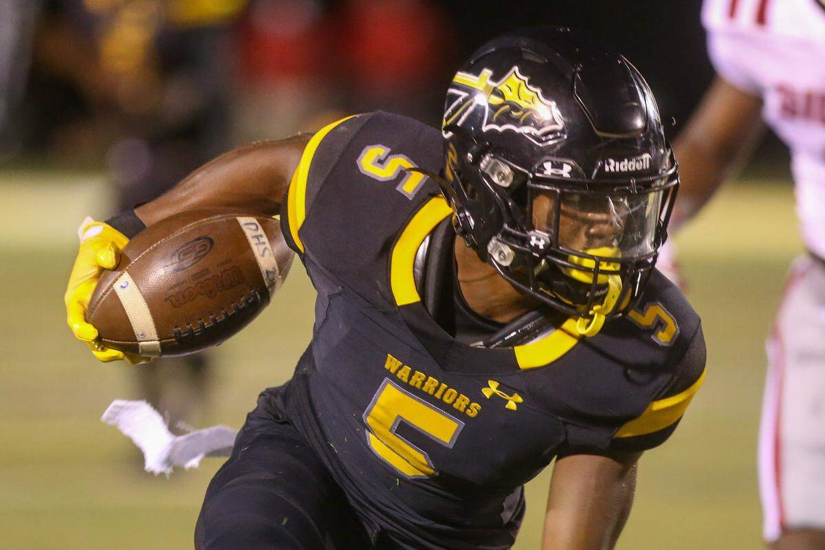 D’Iberville senior Justin Walley runs the ball down field for the Warriors against the Biloxi Indians Friday, Sept. 25, 2020. The Minnesota commit scored three touchdowns in the rivalry game.
