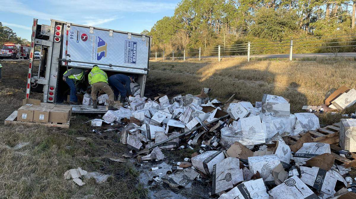 Cargo from semi-truck litters the roadway on Interstate 10 near mile marker 30 in Gulfport after a five-car pileup.