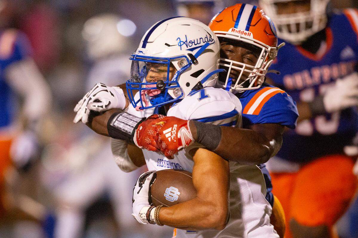 Ocean Springs’ Bryhsen Smith gets tackled during a game against Gulfport at Milner Stadium in Gulfport on Friday, Oct. 27, 2023. Ocean Springs beat Gulfport 30-7.