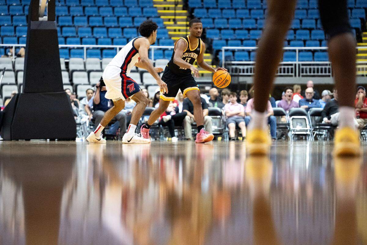 Southern Mississippi guard Dylan Brumfield (13) dribbles the ball upcourt Saturday.