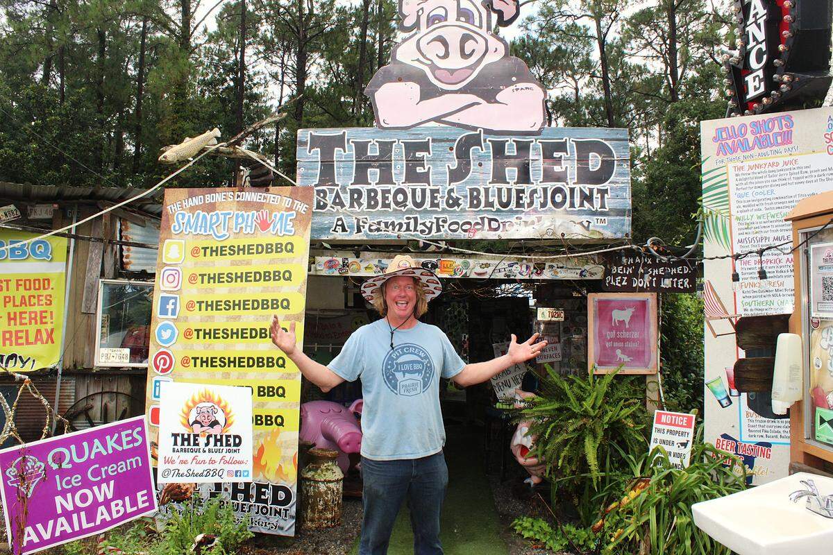 Brad Orrison, co-founder of The Shed BBQ, stands at the entrance of the BBQ and blues joint, located just off of Highway 57 in Ocean Springs.