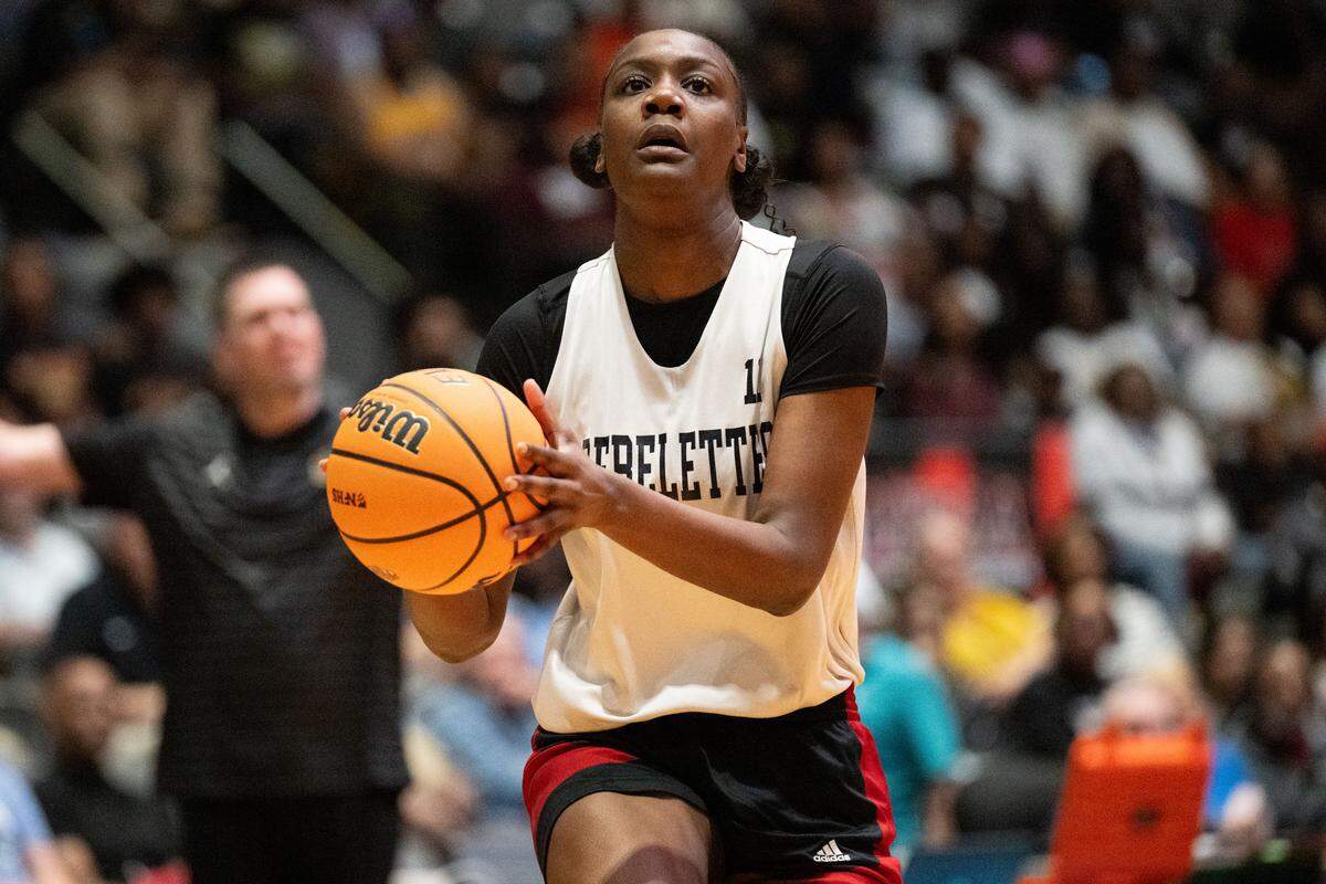 Harrison Central's Saniyah Murray (11) drives to the basket Friday in the Red Rebelettes’ loss to Starkville in the Class 7A girls basketball state final.