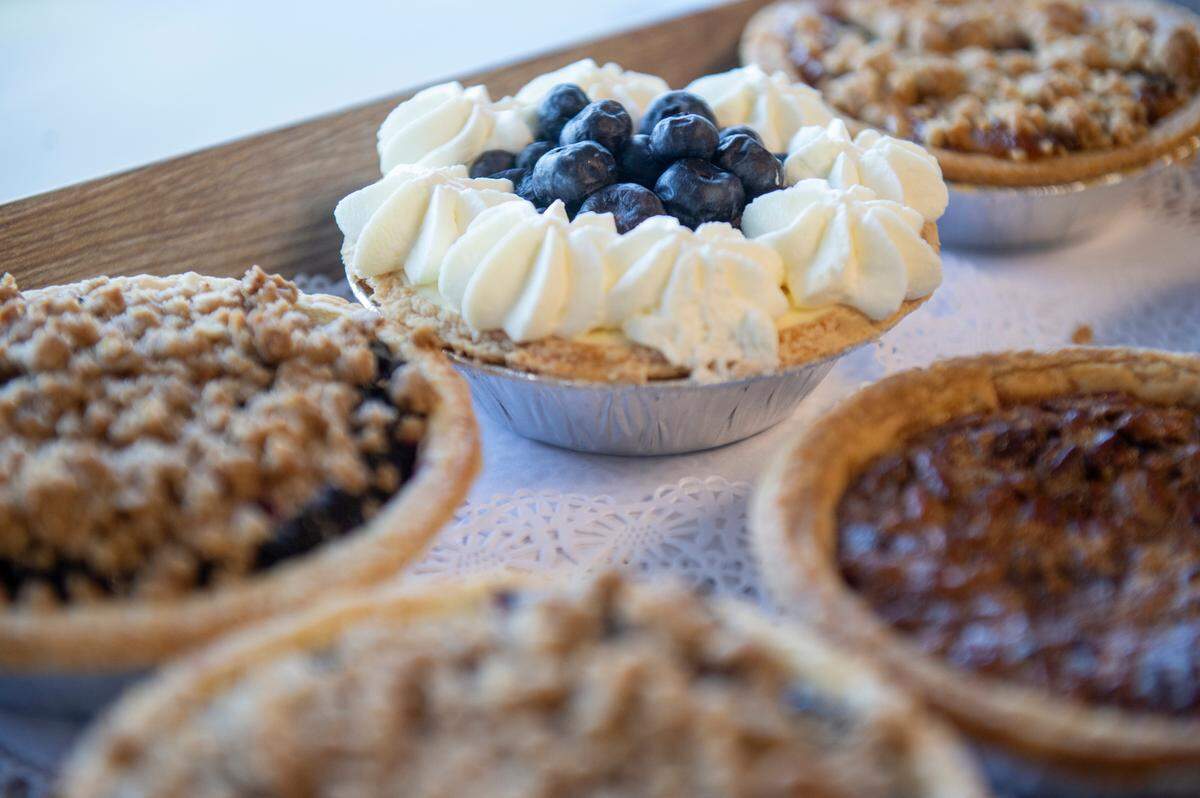 A selection of mini pies, including blueberry, pecan and blackberry available for purchase at Harvest Bay Artisan Bakery in Bay St. Louis on Thursday, Dec. 7, 2023.
