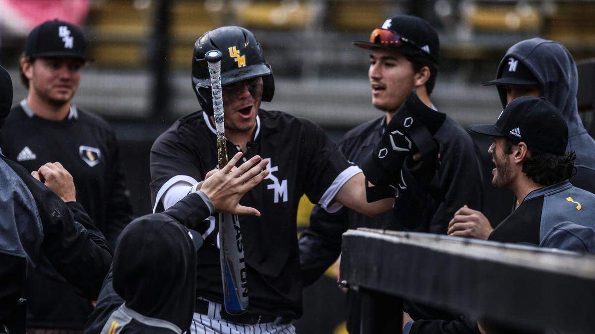 Southern Miss third baseman Danny Lynch celebrates after scoring a run in game three against Murray State Feb. 16, 2020.