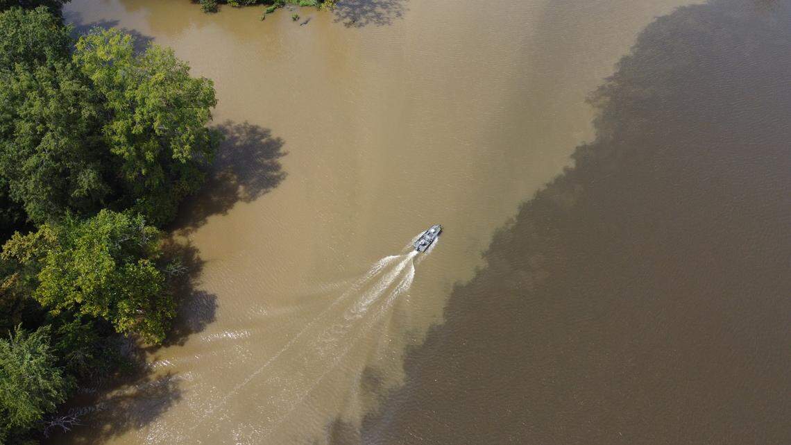 Runoff creates a visible line in the Appomattox River, a major tributary of the James River, which flows into southern Chesapeake Bay in Virginia.
