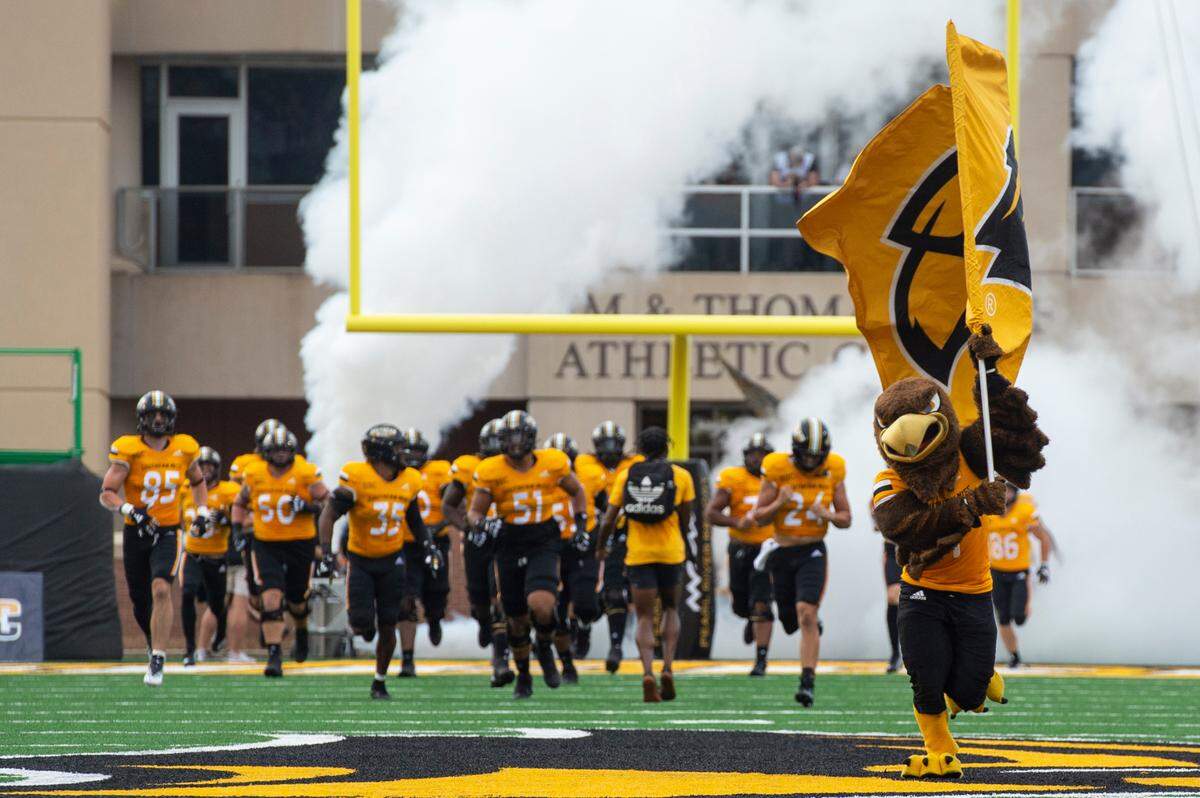 The Southern Miss Golden Eagles run onto the field at M.M. Roberts Stadium in Hattiesburg on Saturday, Sept. 2, 2023.