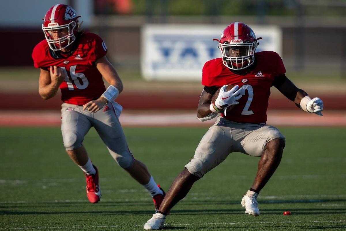 Biloxi’s Jamir Haskin runs a fake during a Jamboree game at Biloxi High School on Friday, Aug. 18, 2023.