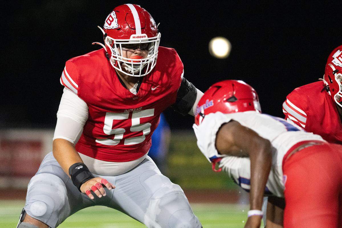 Biloxi offensive lineman Hayden Ainsworth (55) battles a Pascagoula lineman Friday in the Indians’ victory.