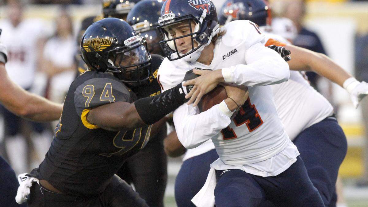 TIM ISBELL/SUN HERALD 
 Southern Miss defensive end Dylan Bradley sacks UTSA quarterback Dalton Sturm on Oct. 17 in Hattiesburg.