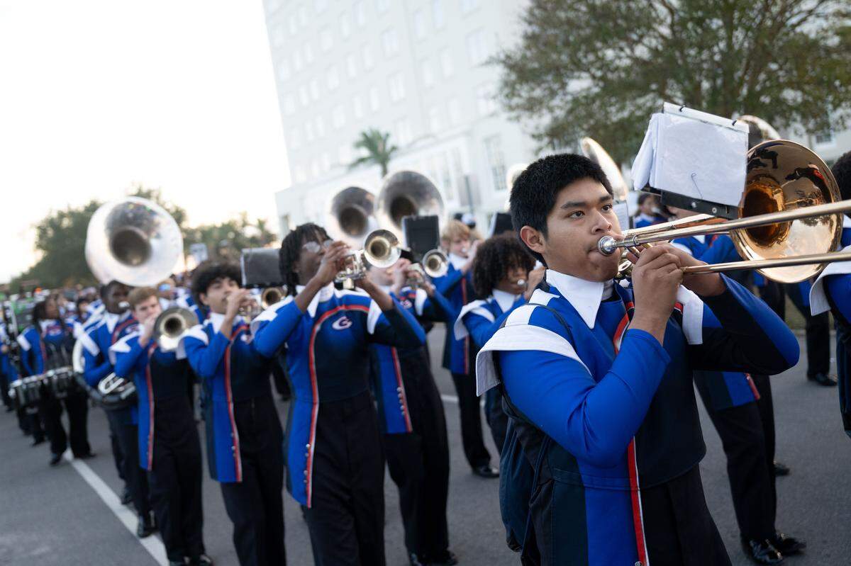 Gulfport band members play songs as they march during the Champions Christmas Parade in Gulfport on Monday, Dec. 8, 2025.