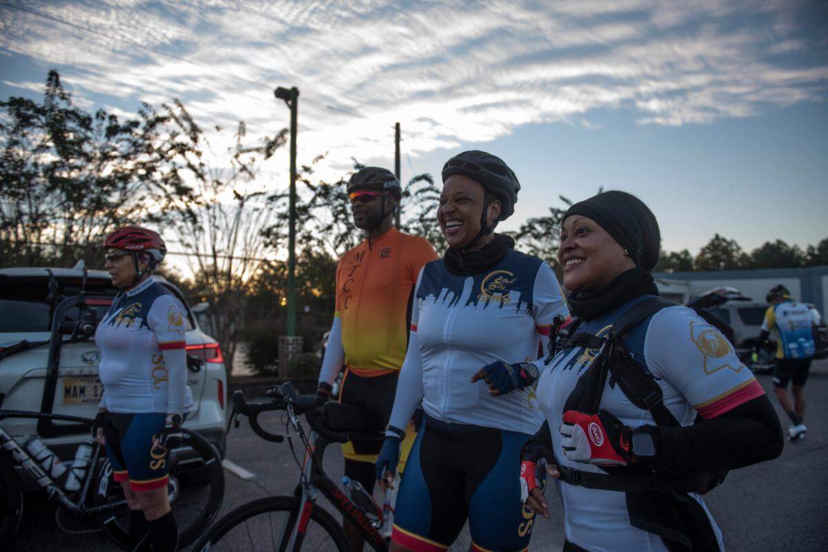 Kendra Patterson, right, and Denise Hardy, center right, and other members of Soul City Cycling prepare for a ride in Woolmarket on Saturday, Sept. 25, 2021. Soul City Cycling, a Major Taylor bike club, is a co-ed bicycling organization.