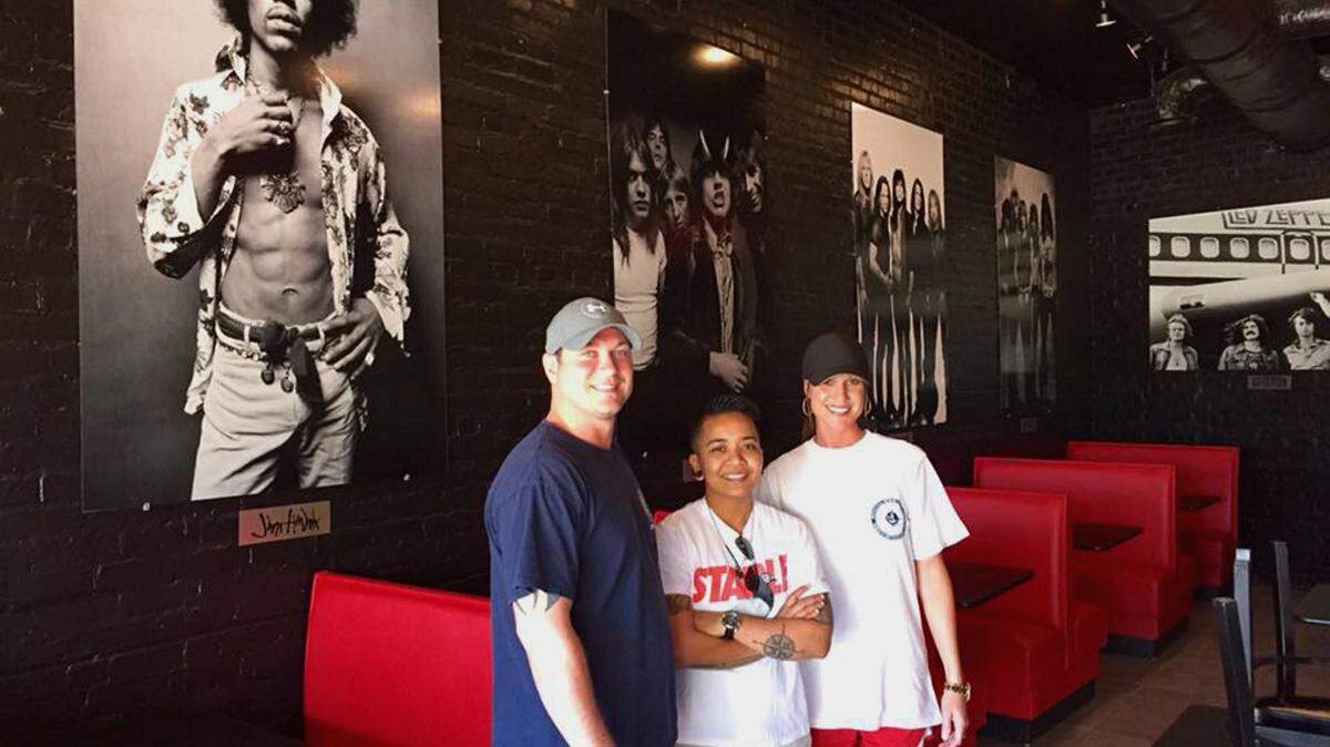 COURTESY OF ROCK-N-ROLL SUSHIRock-n-Roll Sushi restaurant is set to open by the end of May in downtown Gulfport, just north of the railroad tracks on U.S. 49. Chef Ika stands between owners Derek and Courtney Sutherland, who are bringing the popular Alabama franchise to Mississippi.