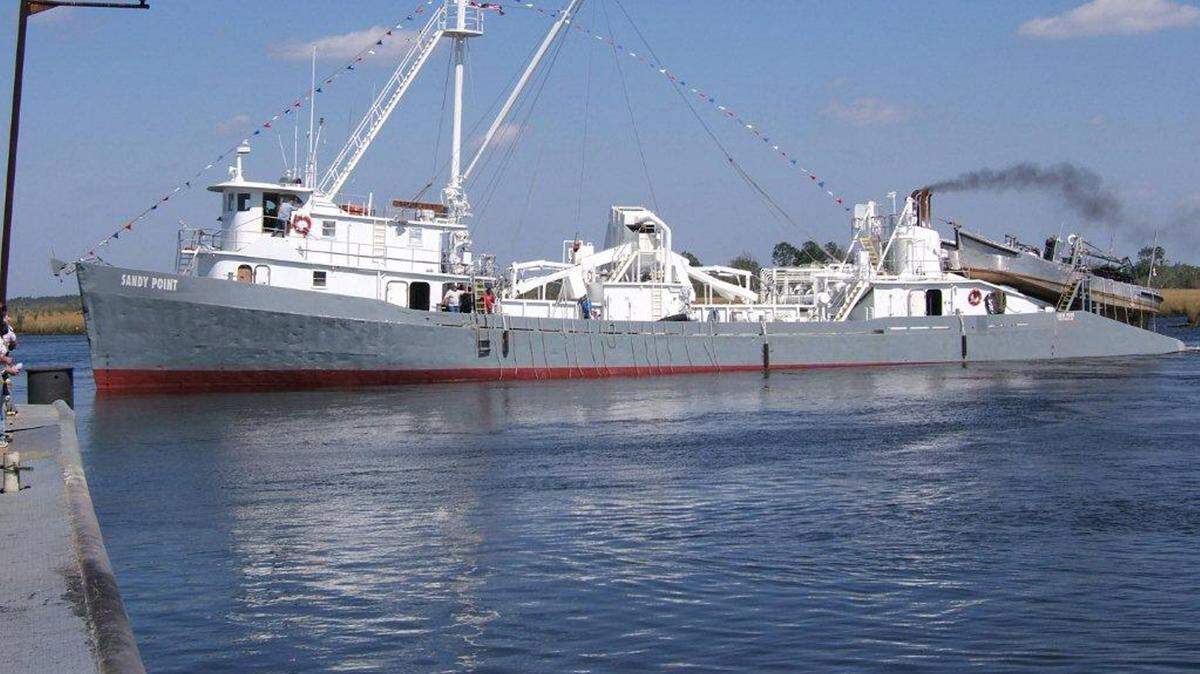 U.S. COAST GUARD 
 This was the 163-foot pogy boat Sandy Point, owned by Omega Protein, before it sank in 2011. Sixteen crew members were on board and three drowned after the pogy boat collided with a cargo vessel four times its size.